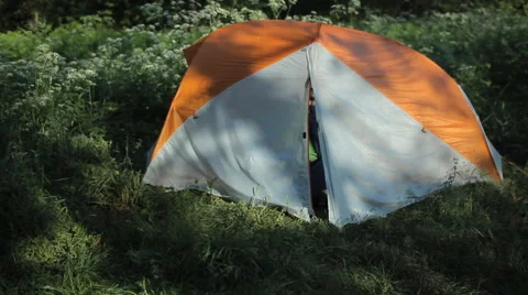 The man opens the tent, making a few photos on the phone and close the tent Stock Footage 64310236