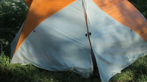The man opens the tent, making a few photos on the phone and close the tent Stock Footage 64310366
