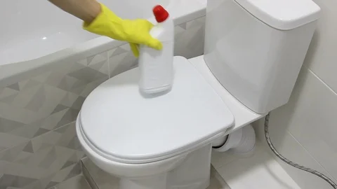 Man opens Toilet Lid, ready to start cleaning. Stock Footage 127981753