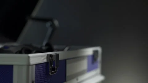 A man opens a tool case. Close-up hands. Box on a black background. Gift for him Stock-Footage 241178988