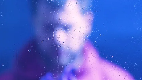A man opens an umbrella Stock Footage 85264798