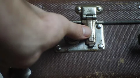 Man opens an vintage suitcase Video stock 35422275