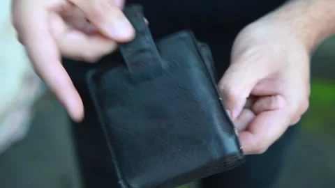 A man opens a wallet that is empty. Stock Footage 131341455