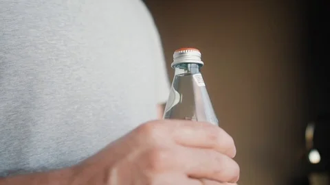 A man opens water bottle Stock Footage 123014121