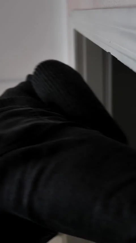 The man opens the white doors and leaves the office or room. Stock Footage 309616159