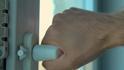 Man opens a window in airing mode Stock Footage 129610294