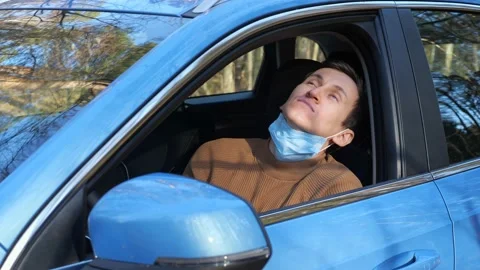 Man opens window and takes off medical mask waiting for help Stock Footage 165172177