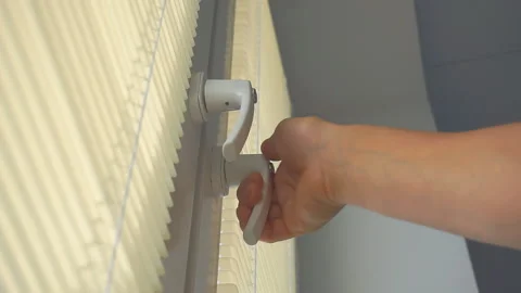  Man opens the window Video stock 94489863