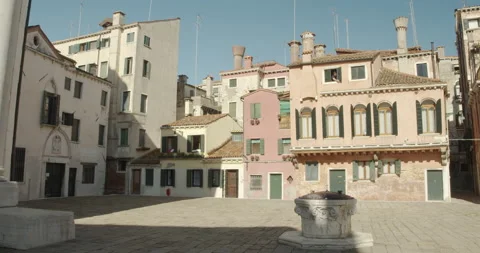 A man opens the windows in a Venice square, June 2020, Italy, Venice Video stock 141689080