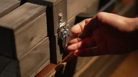 A man opens a wooden box Stock Footage 219651224