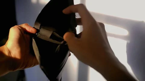 A man opens a worn black leather wallet Stock Footage 289922520