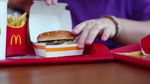 Man opens yellow paper box with Big Mac burger Stock-Footage 338312929