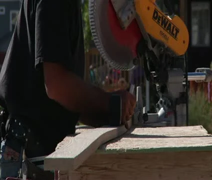 Man operates chop saw Video stock 21563699