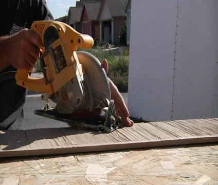 Man operates circular saw Stock Footage 21564681