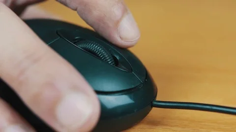 The man operates a computer mouse. Stock Footage 70574391