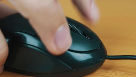 The man operates a computer mouse. Stock Footage 70575322