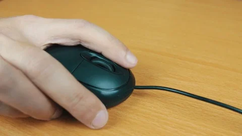 The man operates a computer mouse. Stock Footage 70588667