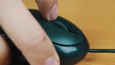 The man operates a computer mouse. Stock Footage 70589524