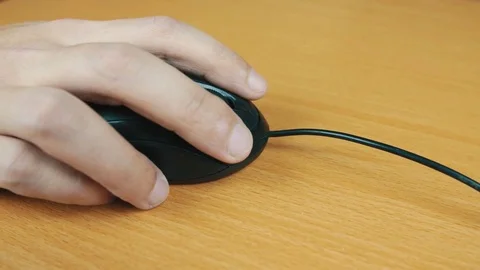 The man operates a computer mouse. Stock Footage 70589678