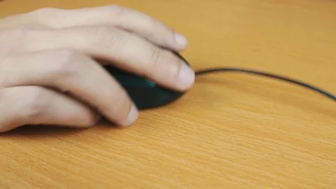 The man operates a computer mouse. Stock Footage 70590704
