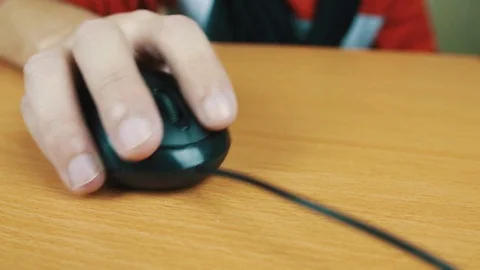 The man operates a computer mouse. Stock Footage 70591132