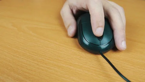 The man operates a computer mouse. Stock Footage 70591492