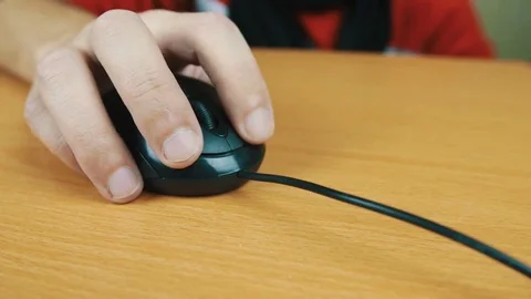 The man operates a computer mouse. Stock Footage 70591564
