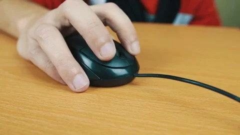 The man operates a computer mouse. Stock Footage 70591964