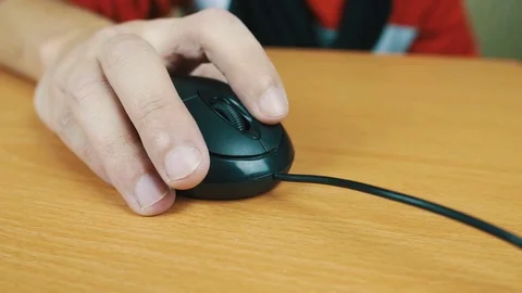 The man operates a computer mouse. Stock Footage 70592056