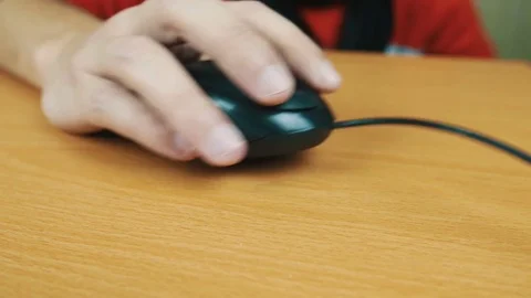 The man operates a computer mouse. Stock Footage 70592603