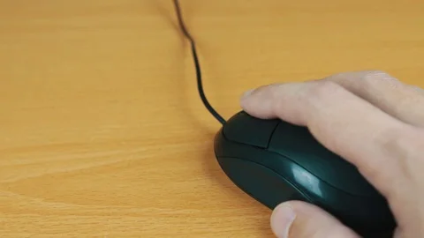 The man operates a computer mouse. Stock Footage 70593704