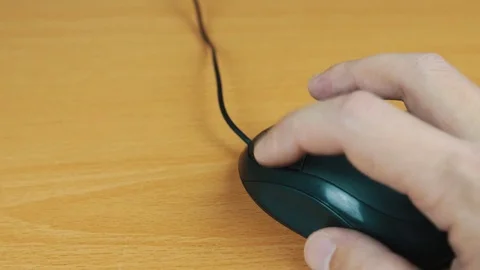 The man operates a computer mouse. Stock Footage 70593743