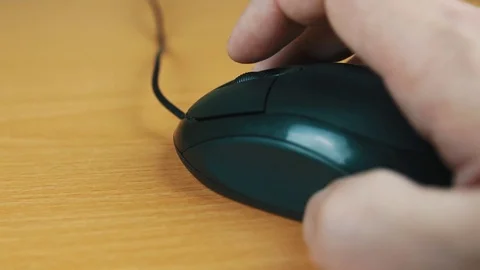 The man operates a computer mouse. Stock Footage 70594087