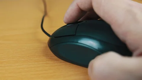 The man operates a computer mouse. Stock Footage 70594133
