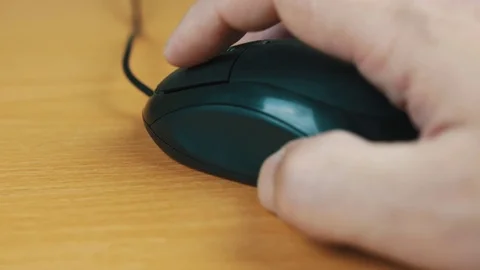 The man operates a computer mouse. Stock Footage 70594868