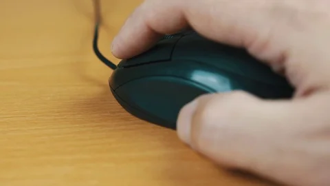 The man operates a computer mouse. Stock Footage 70595121