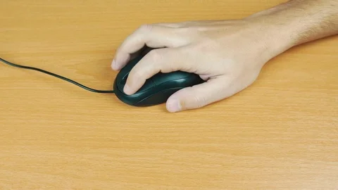 The man operates a computer mouse. Stock Footage 70595358