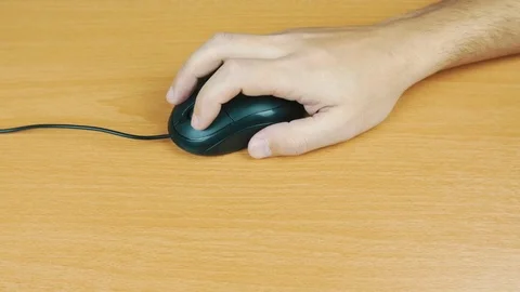 The man operates a computer mouse. Stock Footage 70596349