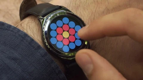 Man operates his smartwatch on the wirst Stock Footage