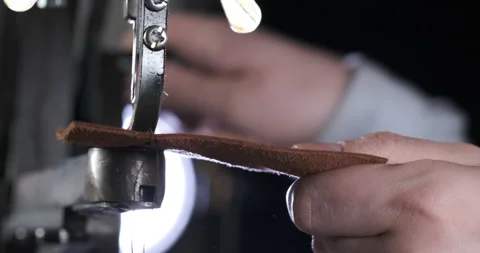 Man Operates Leather Stitching Machine. Outdated Method of Sewing Leather Goods Stock Footage 147730276
