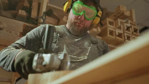 Man Operates Power Saw in Workshop Closeup with woodworker joiner tool Vídeo Stock 347119869