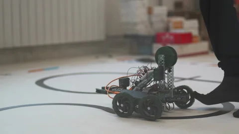 Man operates robot by joystick conducting development test Stock Footage 273031243
