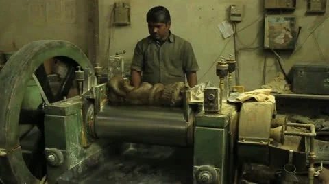 Man Operates Rubber Machine in Indian Factory Stock Footage 16755086