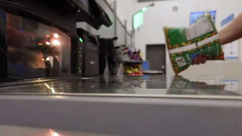 Man operates Self-service Checkout, Scanning His Items and Placing Them in .. Stock Footage 316835293