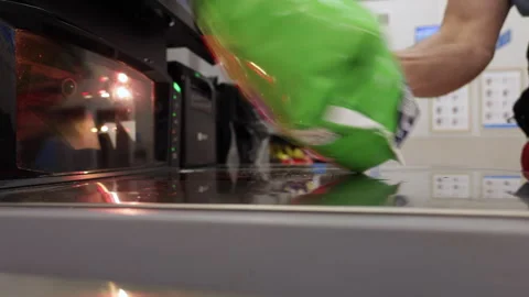 Man operates Self-service Checkout, Scanning His Items and Placing Them in .. Video stock 321816015