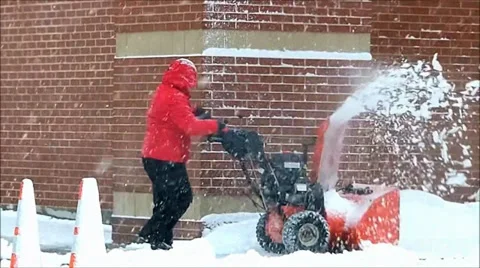 Man operates snowblower Video stock 35335893