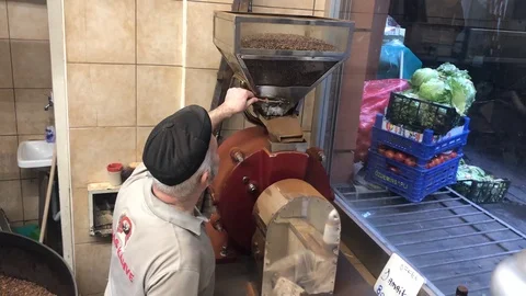 Man operating coffee grinder Stock Footage 104871967