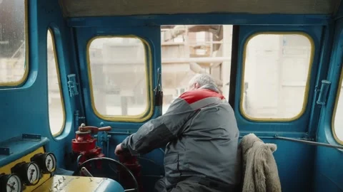 Man operating driving old steam train locomotive, adjusting gas Stock Footage 272791708