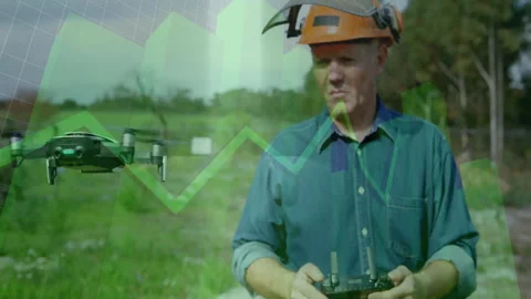 Man operating drone in field showing green bar charts and line graphs powering Stock Footage 307463294