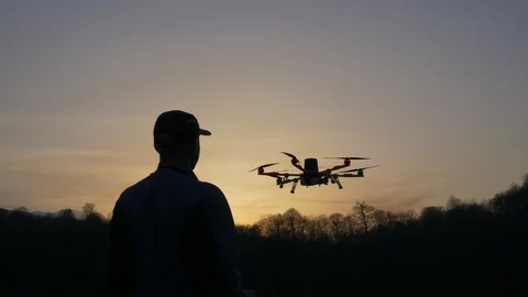 Man operating a drone Stock Footage 88620599